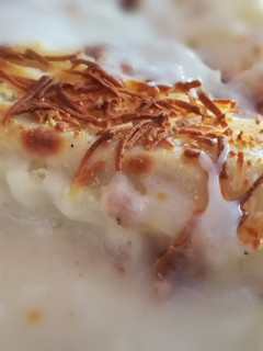 Una foto de Canelones rellenos de pollo asado con verduras y patatas