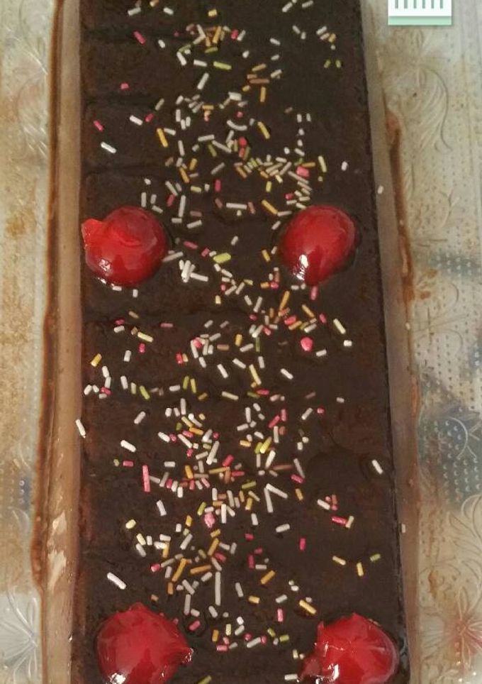 Una foto de Un flan de chocolate café y caramelo
