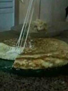 Una foto de Tortilla de papa rellena