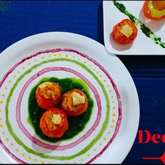 A picture of Soya Stuffed Cheesy Tomato with Spinach gravy.