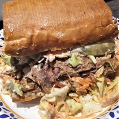 COCHON DE LAIT PO' BOYS A picture of COCHON DE LAIT PO' BOYS.