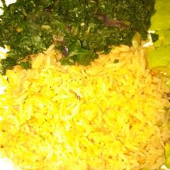 A picture of Tumeric rice served with veges.