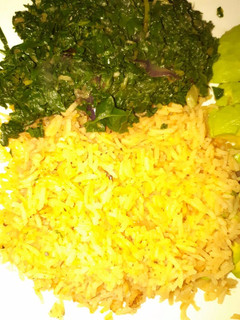 A picture of Tumeric rice served with veges.