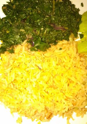 A picture of Tumeric rice served with veges.