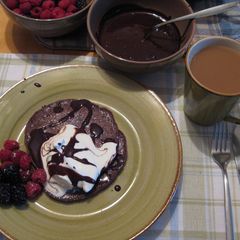 A picture of Chocolate Pancakewith Decadent Chocolate Sauce.