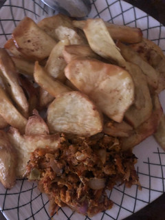A picture of Fried potatoes with egg sauce.
