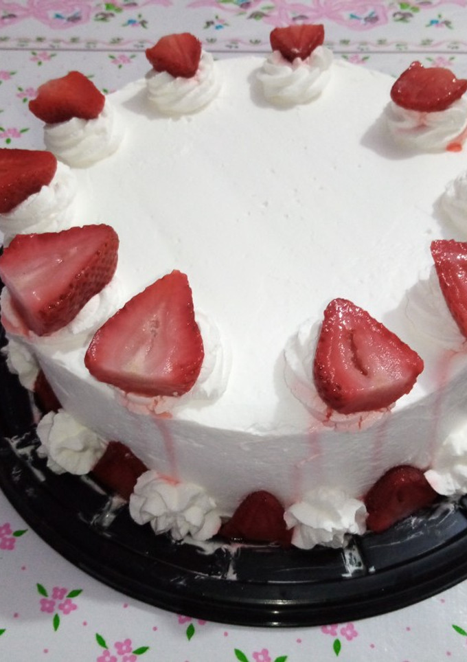 Una foto de Pastel de Tres leches con fresas