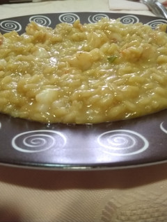 Una foto de Risotto de langostinos al curry