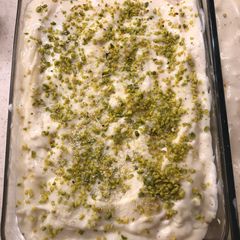 A picture of Lasagne with pistachio pesto, smoked salmon and prawns.