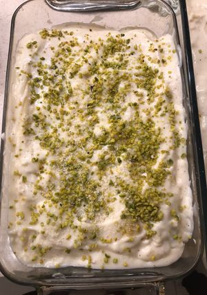 A picture of Lasagne with pistachio pesto, smoked salmon and prawns.