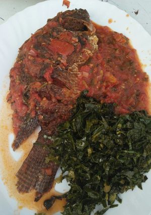 A picture of Wet fried fish with kales.