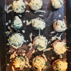 A picture of Cheese stuffed mushrooms.