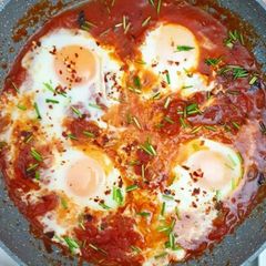 Baked egg with red sauce A picture of Baked egg with red sauce.