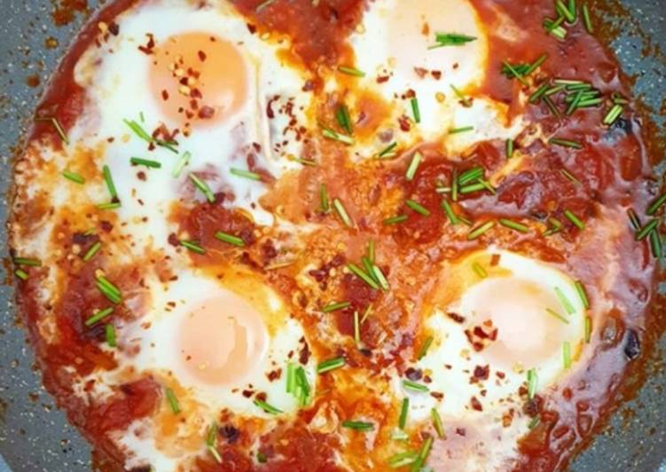 Baked egg with red sauce