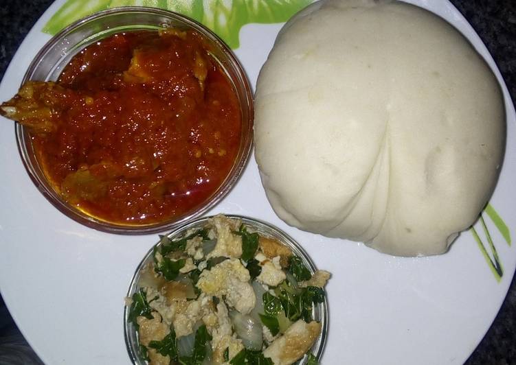 Pounded yam and stew with spinach egg sauce