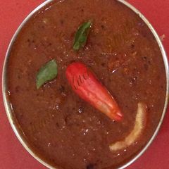A picture of Tomato onion in spicy gravy.