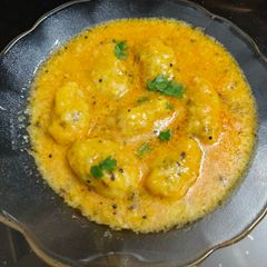 A picture of Gujarati Style Rasiya Muthiya in Pressure Cooker - Soft Melt in mouth Dumplings.