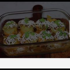 A picture of Aloo dum with cheese.
