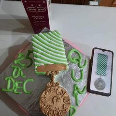 A picture of Quaid e Azam police Medal QPM coffee cake.