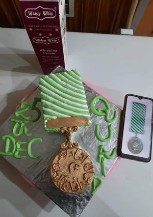 A picture of Quaid e Azam police Medal QPM coffee cake.