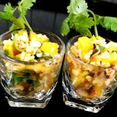 A picture of Raw mango salad shots.