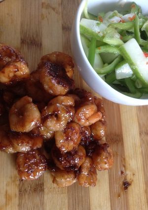 A picture of Sticky basa and prawns with pickled veggies.