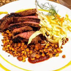 A picture of Mexican Rubbed Steak w/ Chorizo Potatoes & Mango Habanero Salsa.