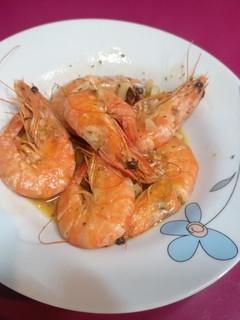 Una foto de Langostinos al vino blanco