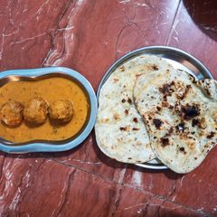 Malai kofta with gravy A picture of Malai kofta with gravy.