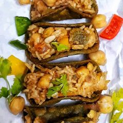 A picture of Crispy spinach tacos stuffed with cheesy chickpeas.