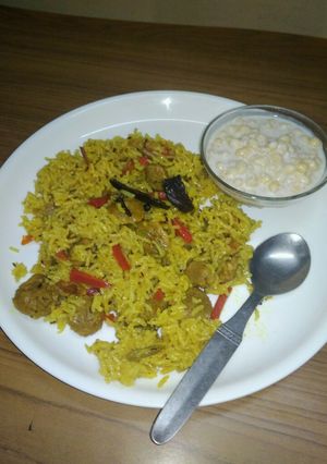 A picture of Soya pulao with raita.