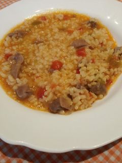 Una foto de Arroz Caldoso con mollejas de pollo