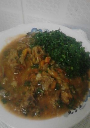 A picture of Wet goats meat,and sukumawiki.