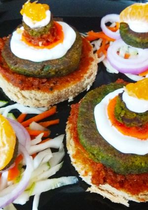 A picture of Hot & Tangy Cheakpea Spinach Tikki Open sandwich.