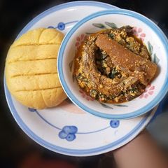 A picture of Palm oil Semo with Melon Soup.