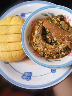 A picture of Palm oil Semo with Melon Soup.