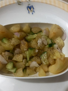 A picture of Apricot salad🍑🥒🧅.