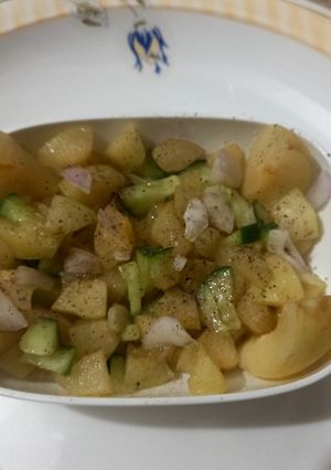 A picture of Apricot salad🍑🥒🧅.