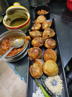A picture of #SIS#Uraddal appe(veg with coriander,pudina onion,tomato chutney.