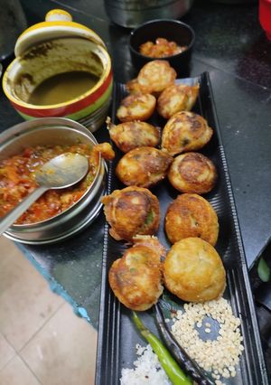 A picture of #SIS#Uraddal appe(veg with coriander,pudina onion,tomato chutney.