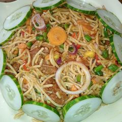 A picture of Pasta with stir fried vegetables and beef.