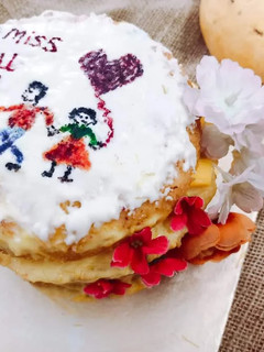 A picture of Mango cake with mango custard and mango chunks filling.