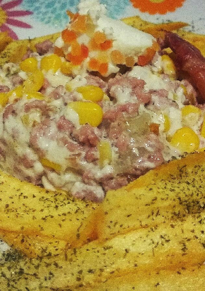 Una foto de Carne con mousse de nueces y maíz