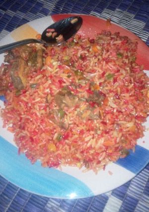 A picture of Coloured fried rice wiz pepper meat.