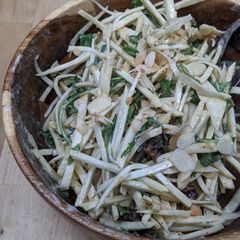 A picture of Celeriac salad with tahini, dates + almonds.