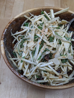 A picture of Celeriac salad with tahini, dates + almonds.
