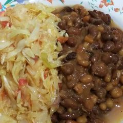 A picture of Dry fried githeri with steamed cabbage.