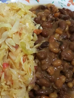 A picture of Dry fried githeri with steamed cabbage.