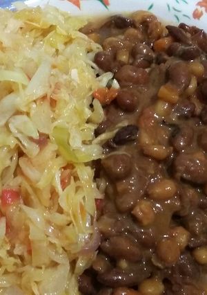 A picture of Dry fried githeri with steamed cabbage.