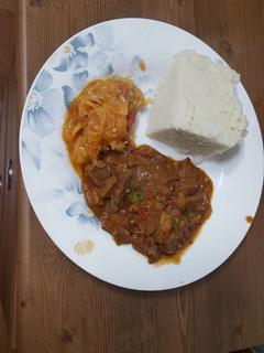 A picture of Beef, cabbage and ugali.
